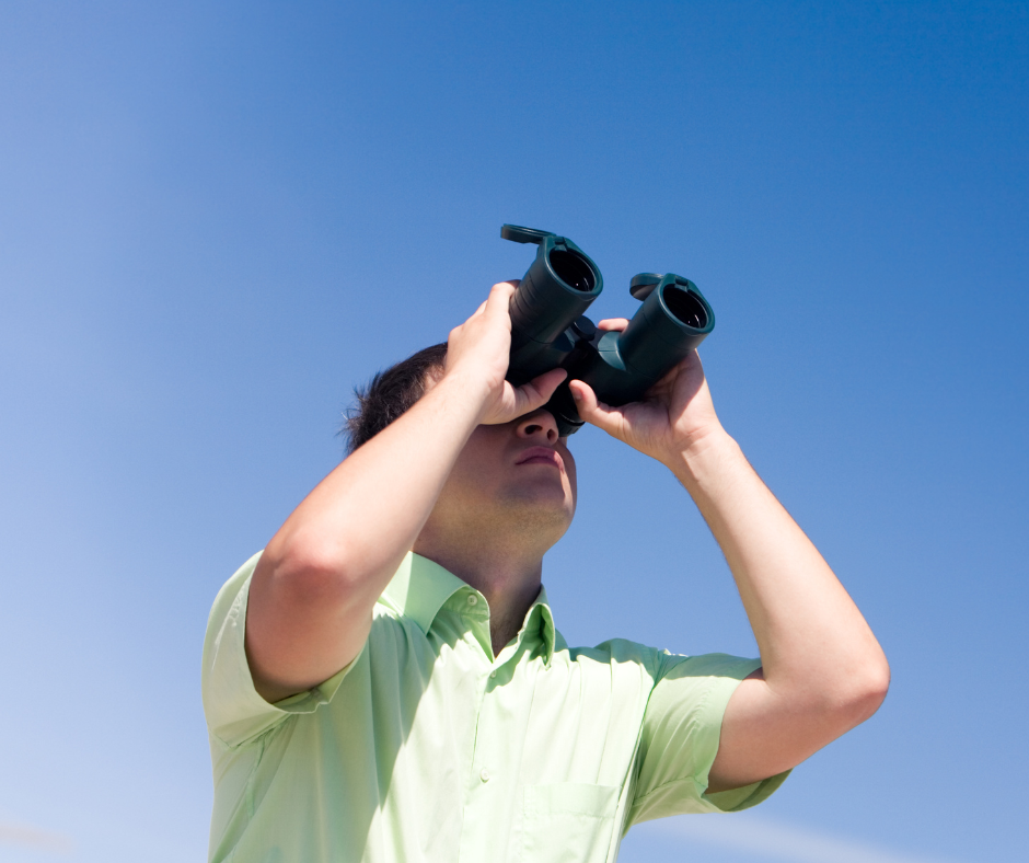 Procurement predictions for 2022 - someone looking through binoculars